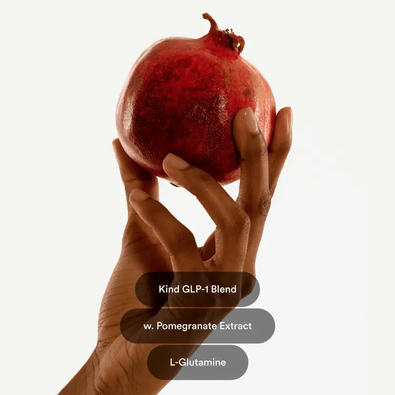 Hand holding a pomegranate with text overlay on a white background