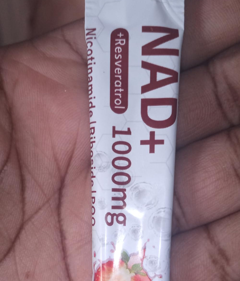 NAD+ supplement packaging with berries on a blurred background